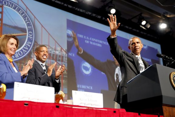 President Barack Obama waves to the crowd before speaking at a mayor's conference in San Francisco, California, on Friday, June 19, 2015.